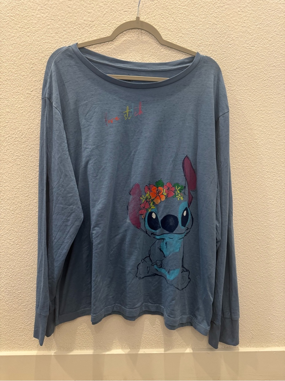 Disney long-sleeve women's T-shirt w/ graphic of Stitch wearing a floral crown
